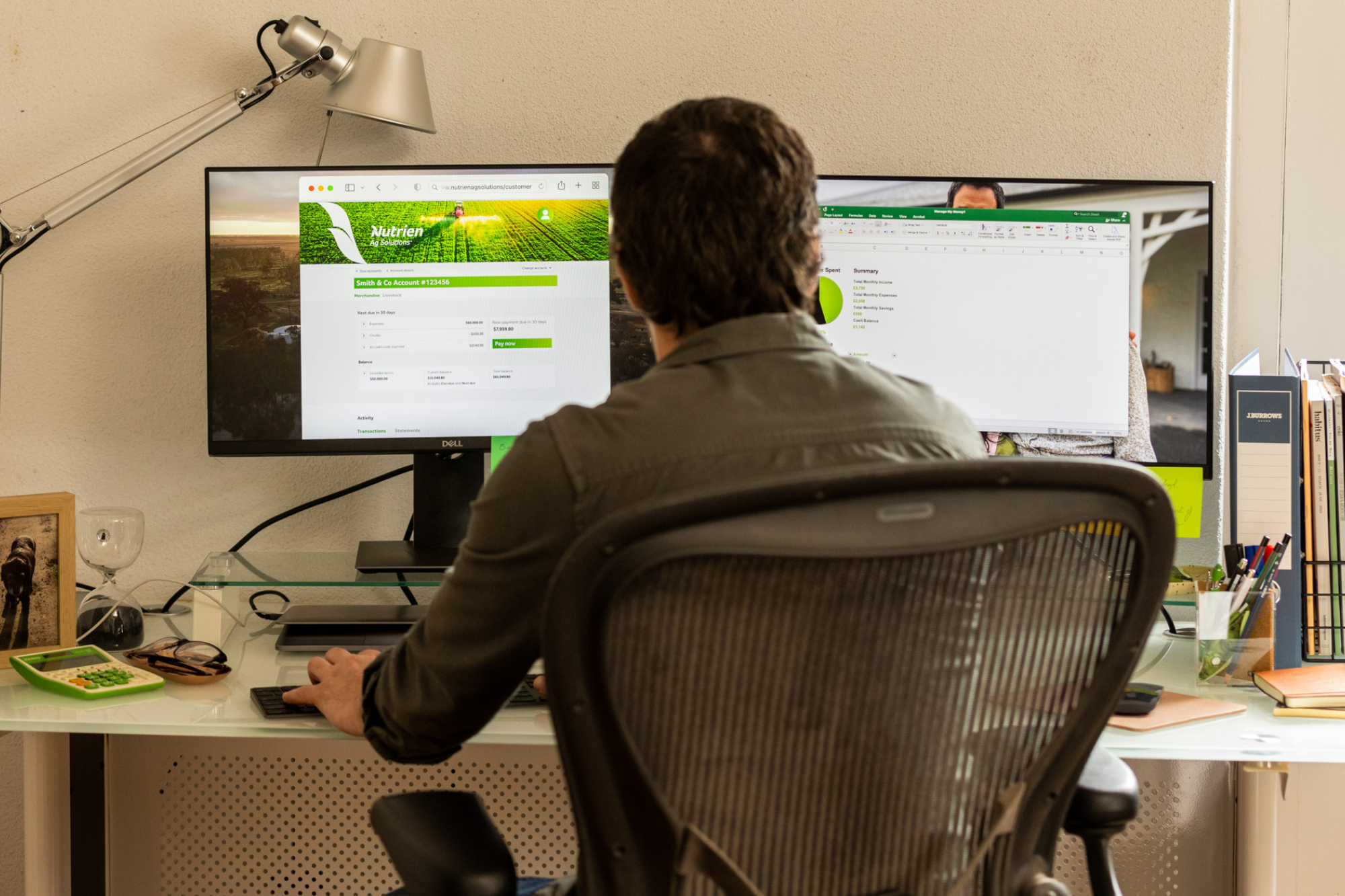 Man sitting at computer managing accounts.